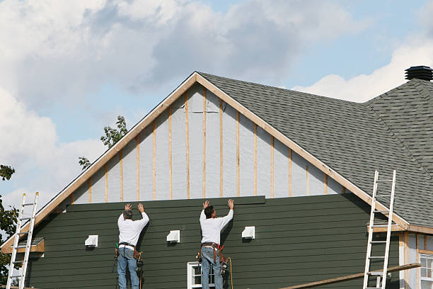 Professional Siding Installation technician working in Boxborough, MA